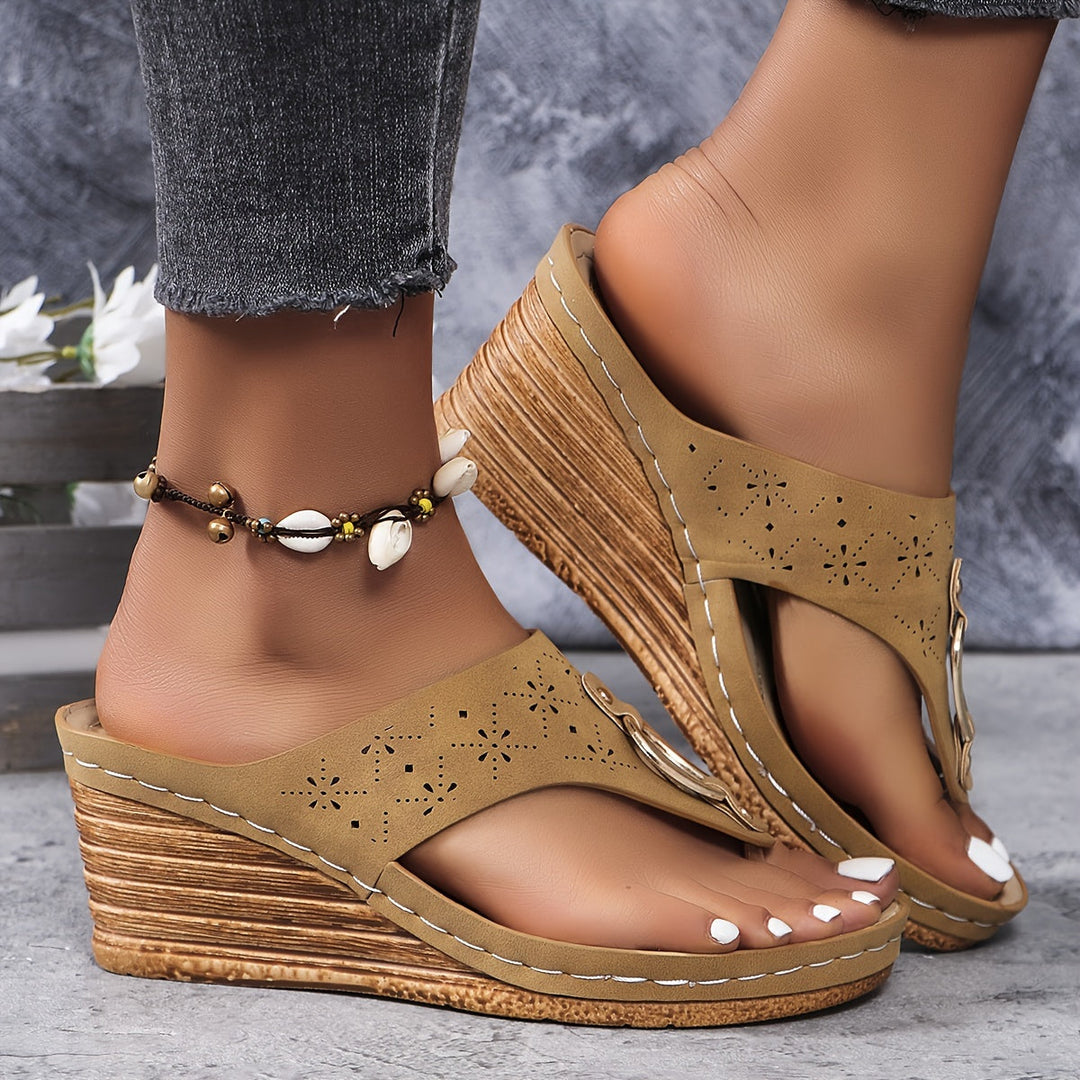 Yellow cutout platform wedge sandals on foot